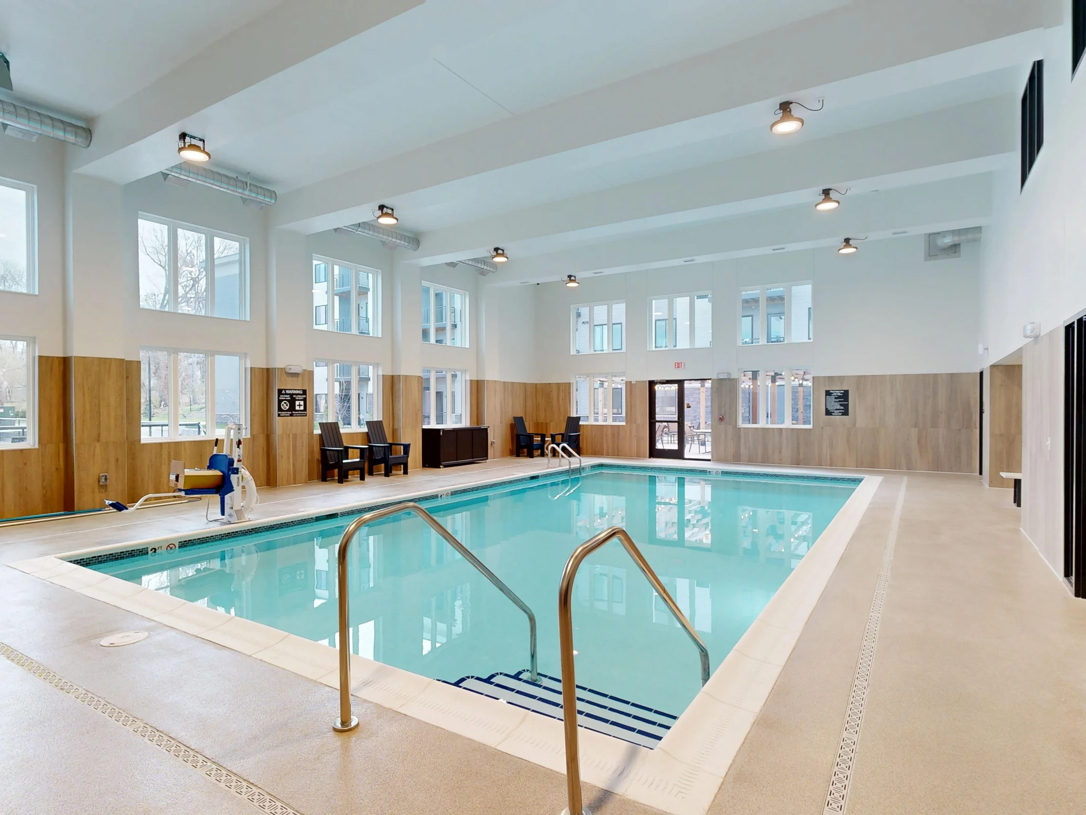 Sunlit indoor swimming pool at Aura